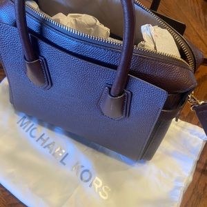 Authentic Michael Kors purse and wallet. Excellent condition. Like new. Burgundy